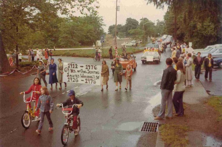 A photo of people holding a banner during the 50th parade.
