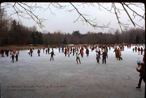 People ice skating on the lake in 1970s.